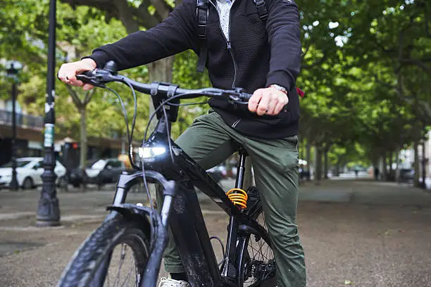Rider on an electric bike commuting through the city